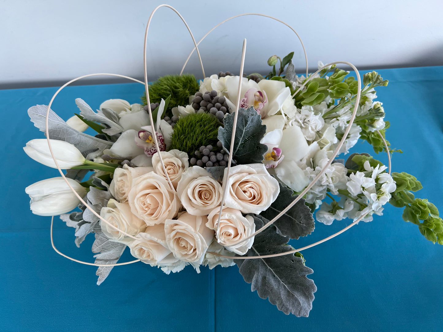 Tulips with white roses and orchids