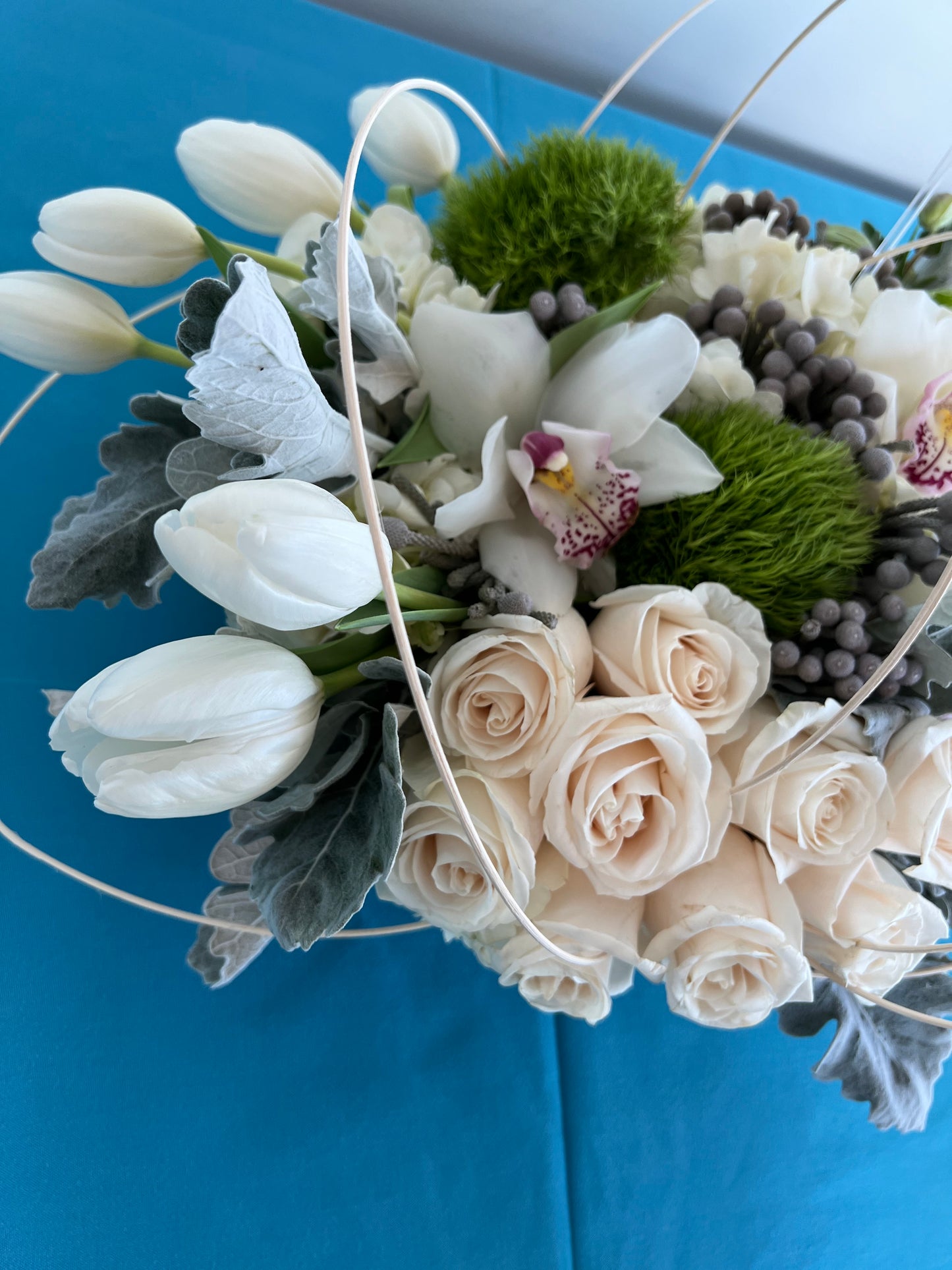 Tulips with white roses and orchids