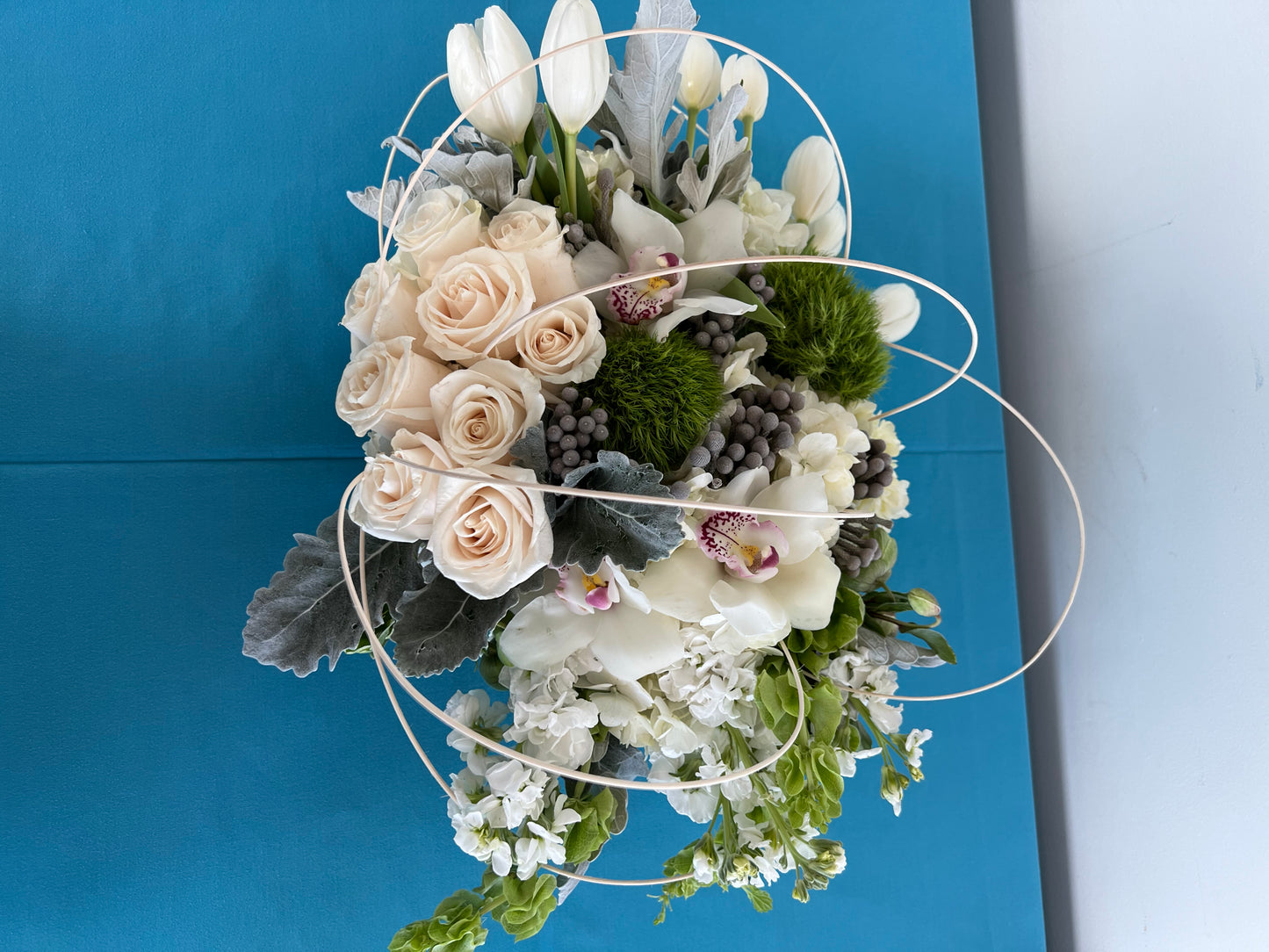 Tulips with white roses and orchids