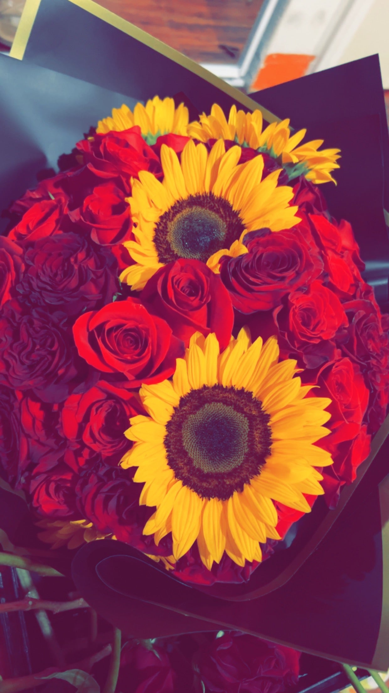 20 red roses with 3 sunflowers rap as bouquet