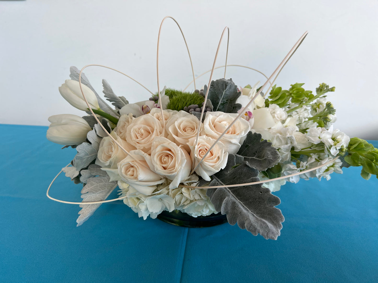 Tulips with white roses and orchids