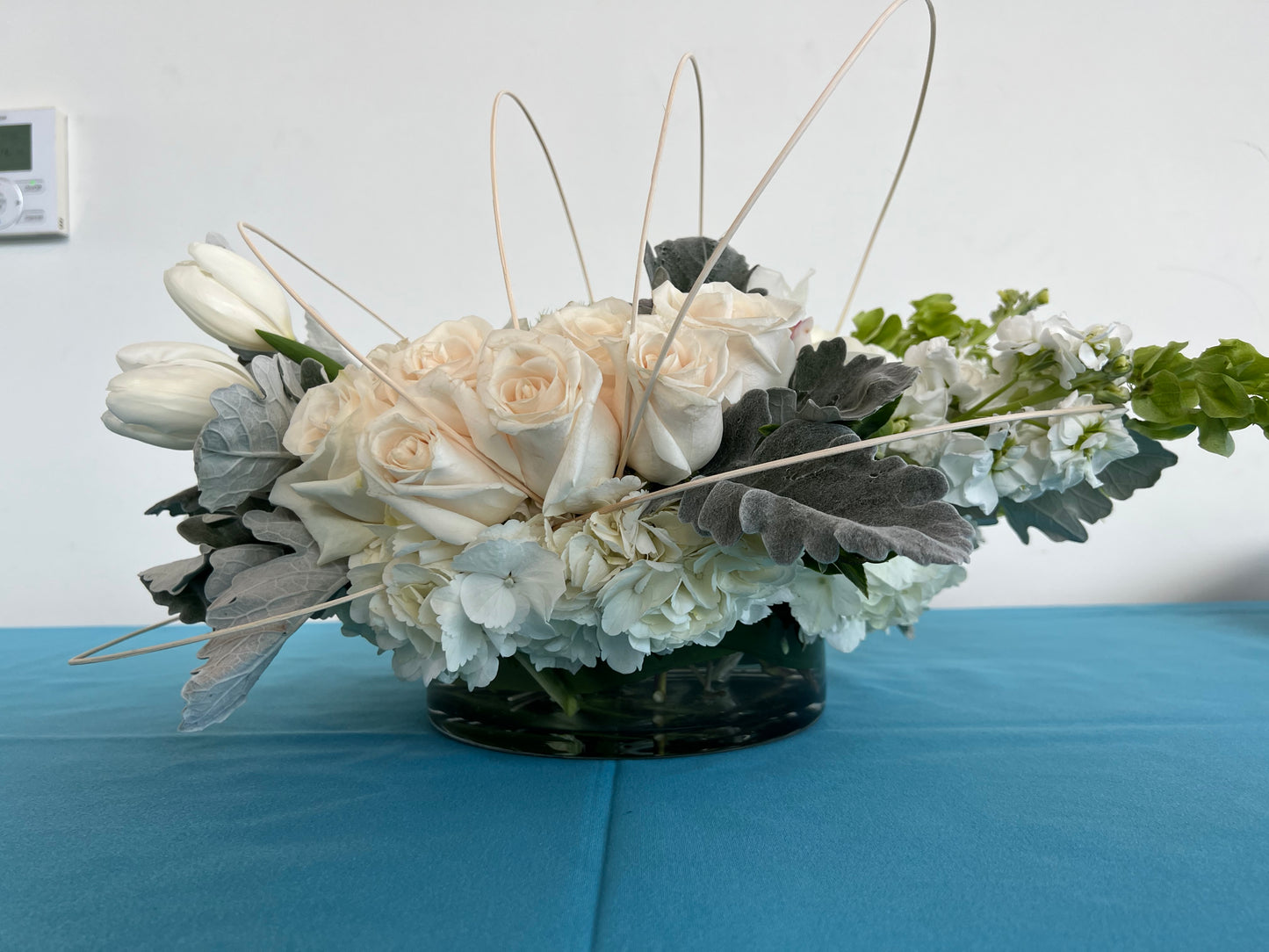 Tulips with white roses and orchids